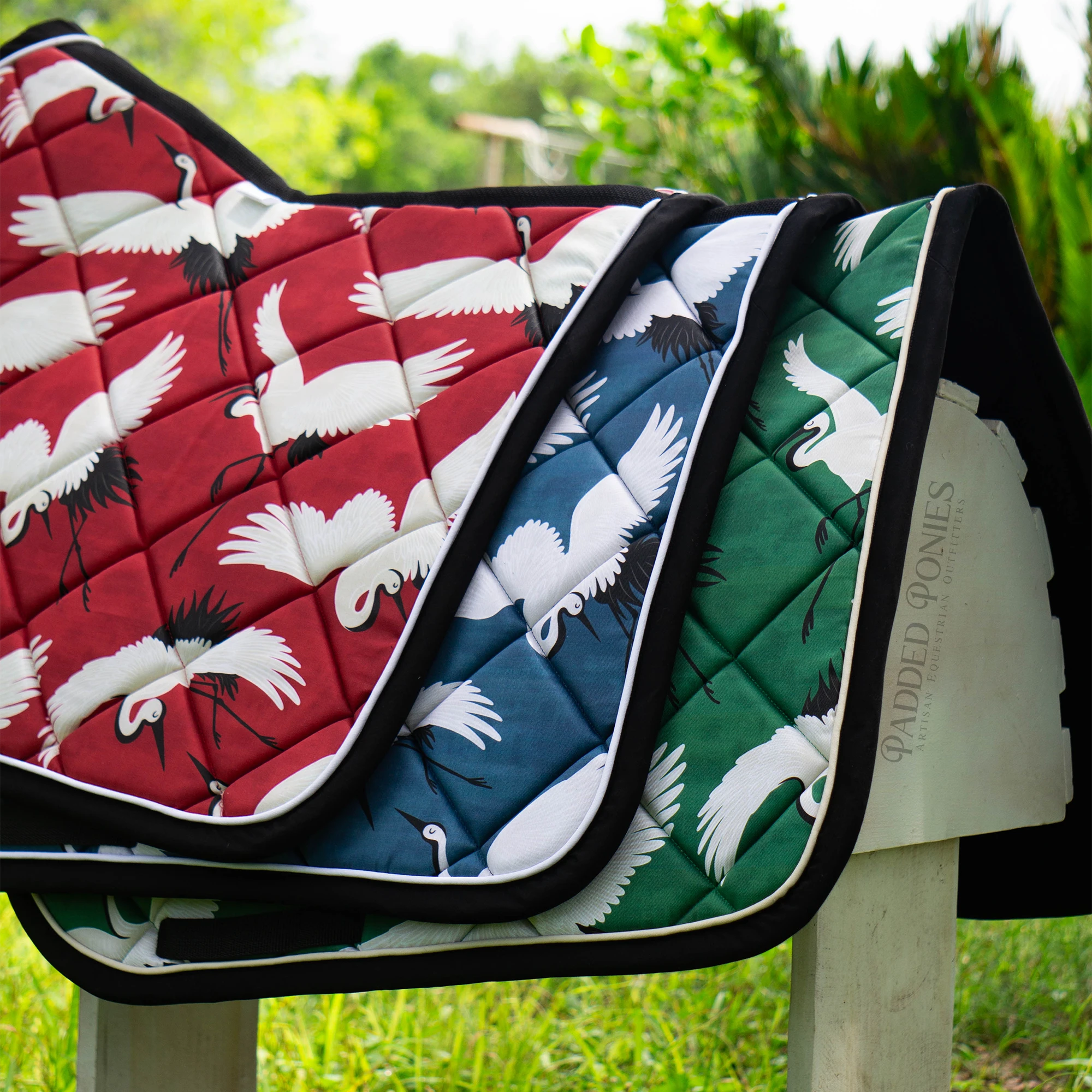 Flightpath Cranes Collection Saddle Pads in Crimson, Denim, and Emerald